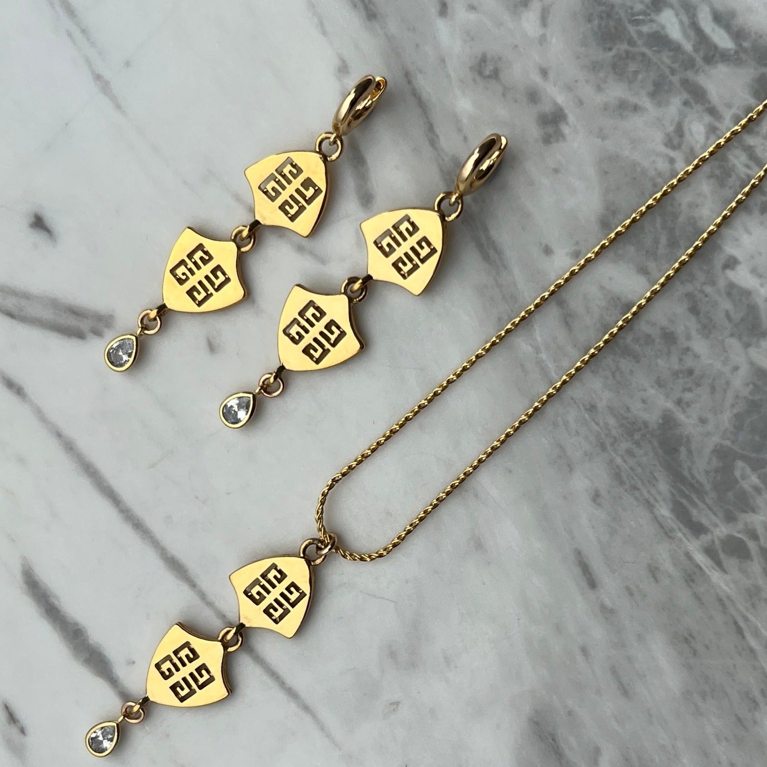 Statement Gold Double Logo Necklace with Crystal Drop