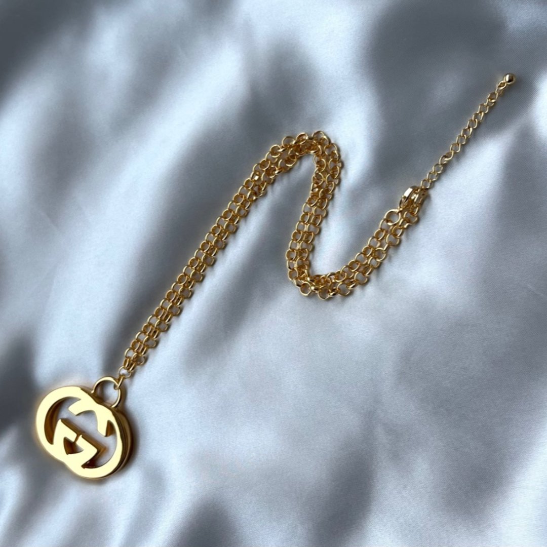 Statement Gold Logo Necklace